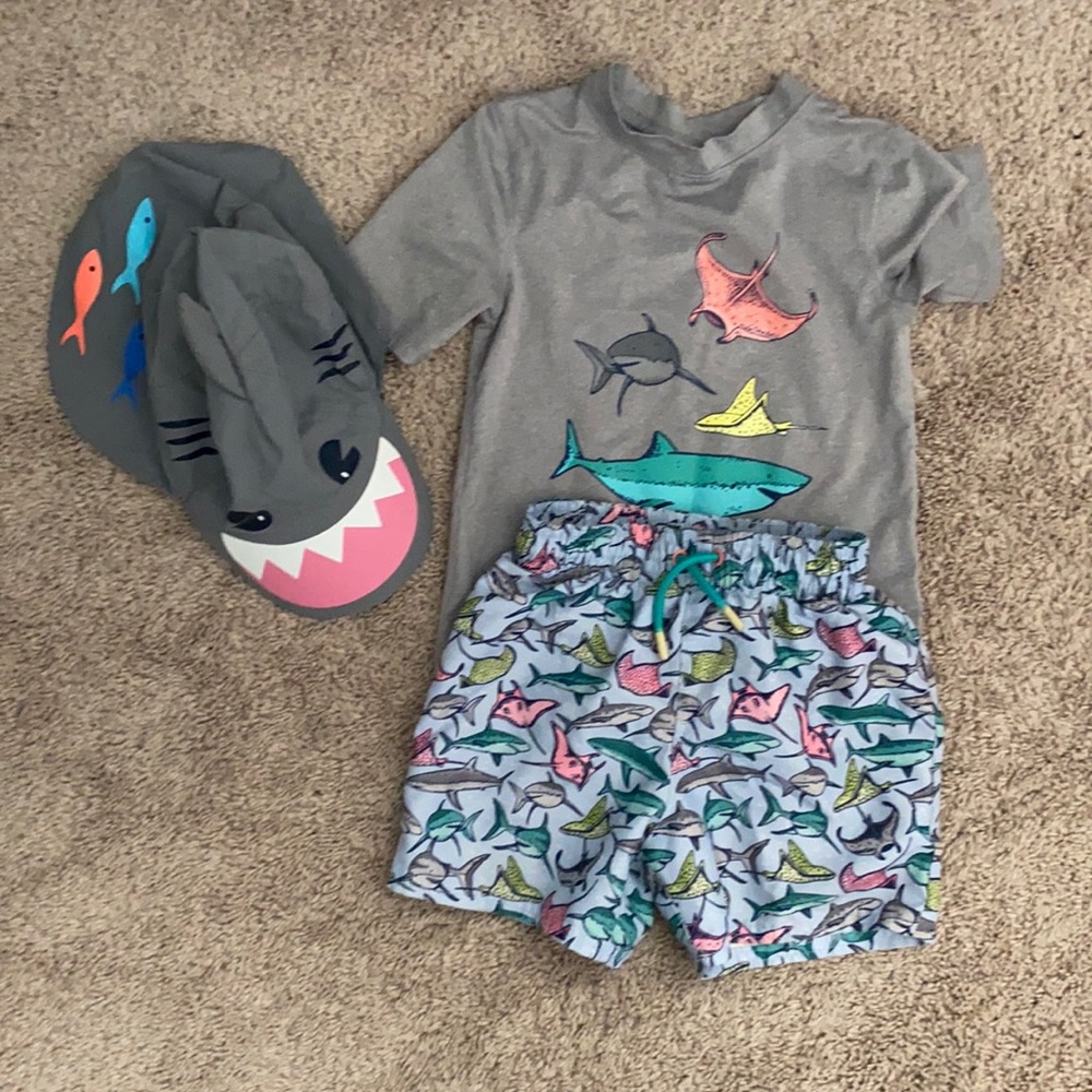 Trunks, rash guard, and sun hat